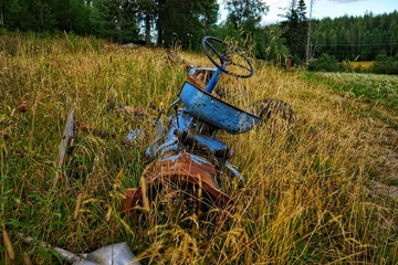 Abandoned old tractor in the field