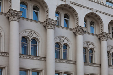 Fototapeta premium Facade of an old building with columns connected by arches