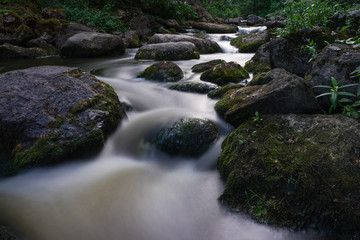 Water streaming in river in summer night