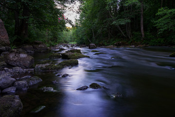 Water streaming in river in summer night