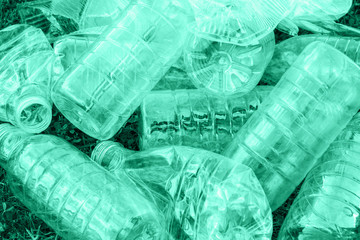 Pile of used green plastic bottles, the concept of ecology. Waste separation concept.