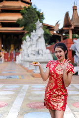 Beautiful asian woman holding dollars or money with lucky pocket money,in the Chinese New Year. Festivities, New Year Celebration  concept.