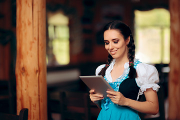 Oktoberfest Bavarian Waitress Holding PC Tablet Welcoming Guests
