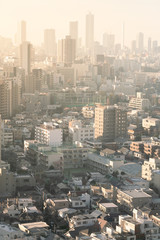 Obraz premium PM2.5 Unhealthy air pollution dust smoke in the urban city. Low visibility city view with dangerous haze and fog.