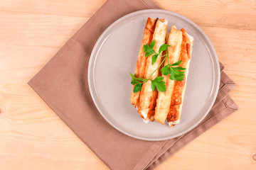 Traditional Turkish Pastries sigara borek - Deep Fried pies with cottage cheese and parsley.