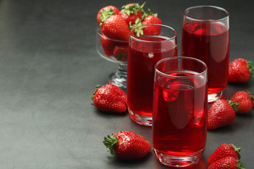 Glasses with strawberry drink with ice