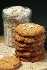 Homemade oatmeal cookie at dark background