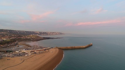 Folkestone's harbour Arm from the air with Dover in the distance.