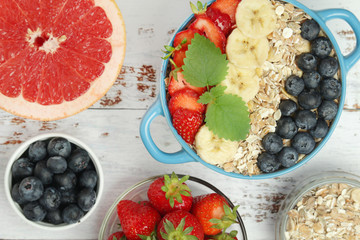 Healthy diet breakfast including cereal with berry and fruits	