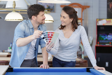 a couple is choosing colors