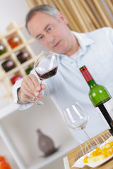 a winemaker tasting white wine