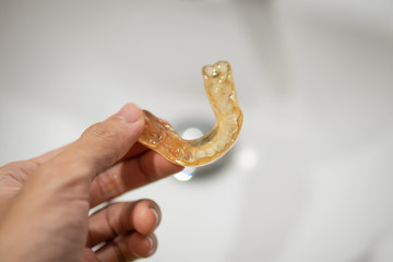 Fototapeta premium mouth guard for anti bruxism in men hand