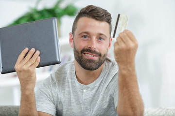 businessman shopping online at desk in office