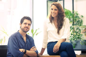 Obraz premium Head shot portrait of CEO and CTO of a young and successful startup technology company. 