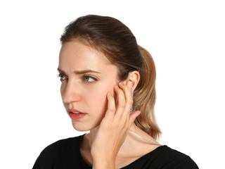 Female security guard using radio earpiece on white background