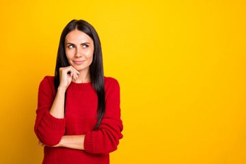 Portrait of minded girl think look at copyspace wear red jumper isolated over yellow background