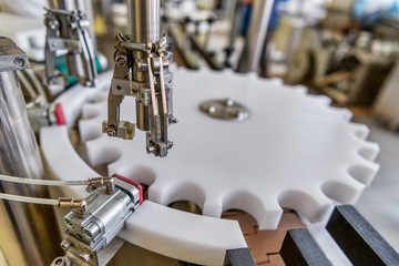 Automatic line for filling and labeling drugs.