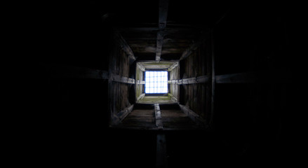 Fototapeta na wymiar Wooden tunnel looking up - Grid underground
