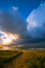 Naklejka na ściany i meble Fast weather change after days rather boring weather. Welcomed by the people. Baltic Sea in summer. People did not even shy away from approaching lightning and thunder. (The photographer fled...)