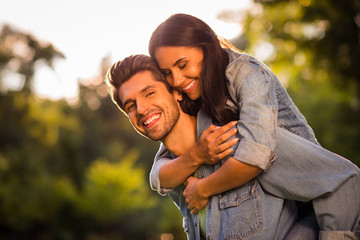 Close up photo of attractive married youth cuddling pigyback wearing denim jeans jackets blazers...