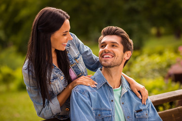 Close up photo of charming married people with long haircut looking wearing jeans denim jackets blazers outdoors