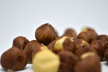 Heap of hazelnuts on a white background. Raw hazelnuts isolated on white background.