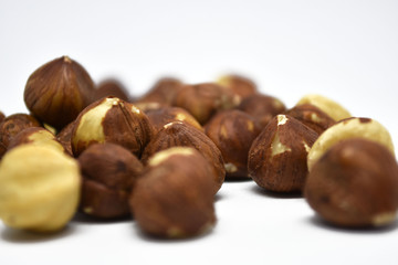 Heap of hazelnuts on a white background. Raw hazelnuts isolated on white background.