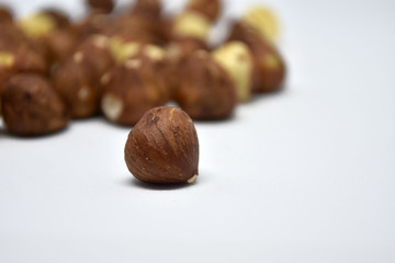 Heap of hazelnuts on a white background. Raw hazelnuts isolated on white background.