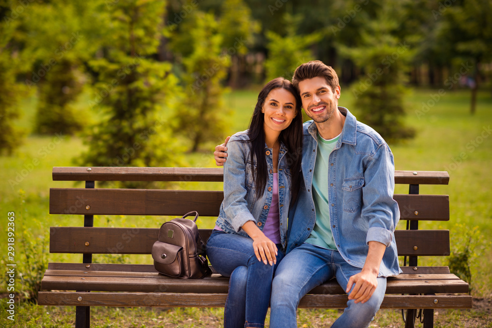 Poster Portrait of his he her she nice attractive lovely charming amorous affectionate cheerful cheery married spouses wearing denim embracing in green wood forest outdoors