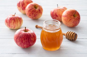 Apples and honey on a wooden background for jewish new year rosh hashanah	