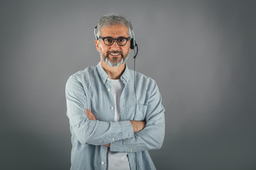 customer support concept, man causal attire wearing headset