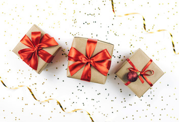 Christmas gift boxes on white sparkling background.