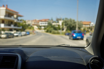 Fototapeta premium inside view of the car on the road in summer. it's raining