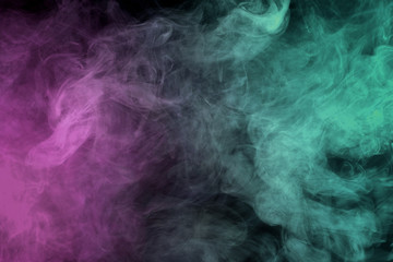 Abstract smoke on a dark background.  Movement of color smoke