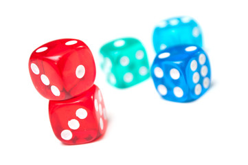 Closeup of colorful dices on white background
