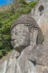 Mount Nokogiri (Nokogiriyama) Great Buddha (Nihon-ji daibutsu). Carving of seated sculpture of Yakushi Nyorai completed in 1783.  The largest pre-modern stone-carved Daibutsu in Japan