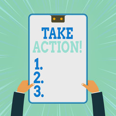 Conceptual hand writing showing Take Action. Concept meaning do something official or concerted to achieve aim with problem Two male hands holding electronic device geometrical background