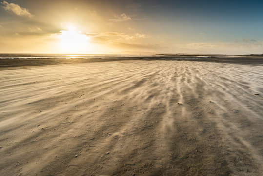 Strong winds on Camber Sands beach, East Sussex