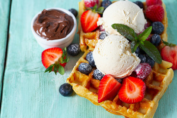 sweet belgian waffles with berries and ice cream