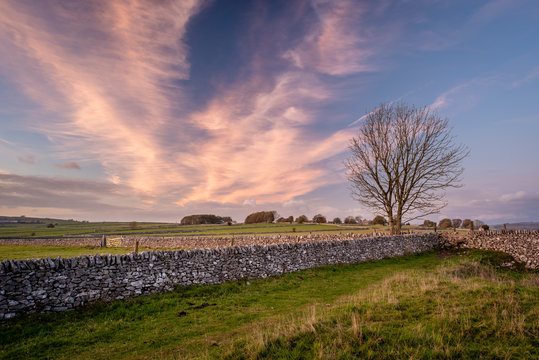 Stone walls and fields at sunset in autumn, Sheldon, Peak District National Park, Derbyshire