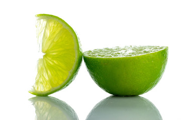 Fototapeta na wymiar Lime light. Fresh juicy green lemon isolated on white background