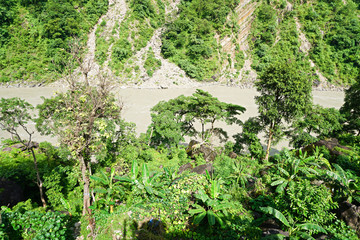 Fototapeta na wymiar Muddy River in a jungle canyon
