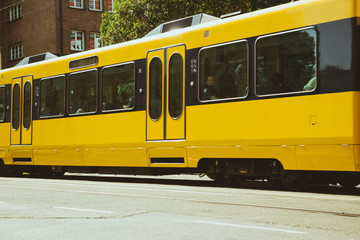 Plakat yellow tram, subway in a city