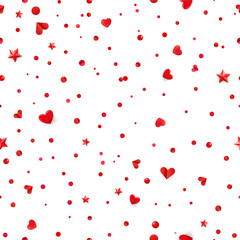 Seamless vector pattern with red hearts and confetti