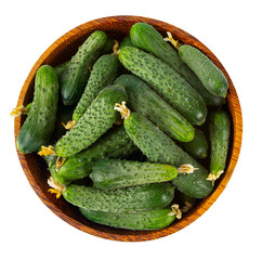 cucumbers in a bowl isolated on white