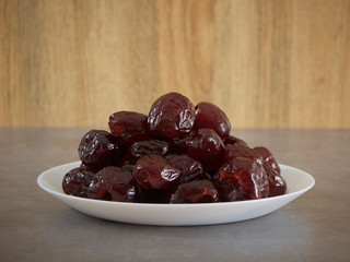 Jujube in syrup on a white plate