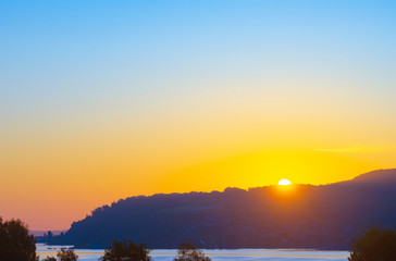 Sunrise on a Sunday morning at Lake Constance in the late summer month of September.