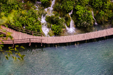 The view from the top. Wooden bridge running across the lake.