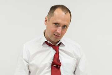 Portrait of a business man looking depressed. Man exhausted about work. Overworked businessman isolated over white background