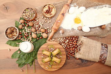 Baklava with ingredients on the wooden table